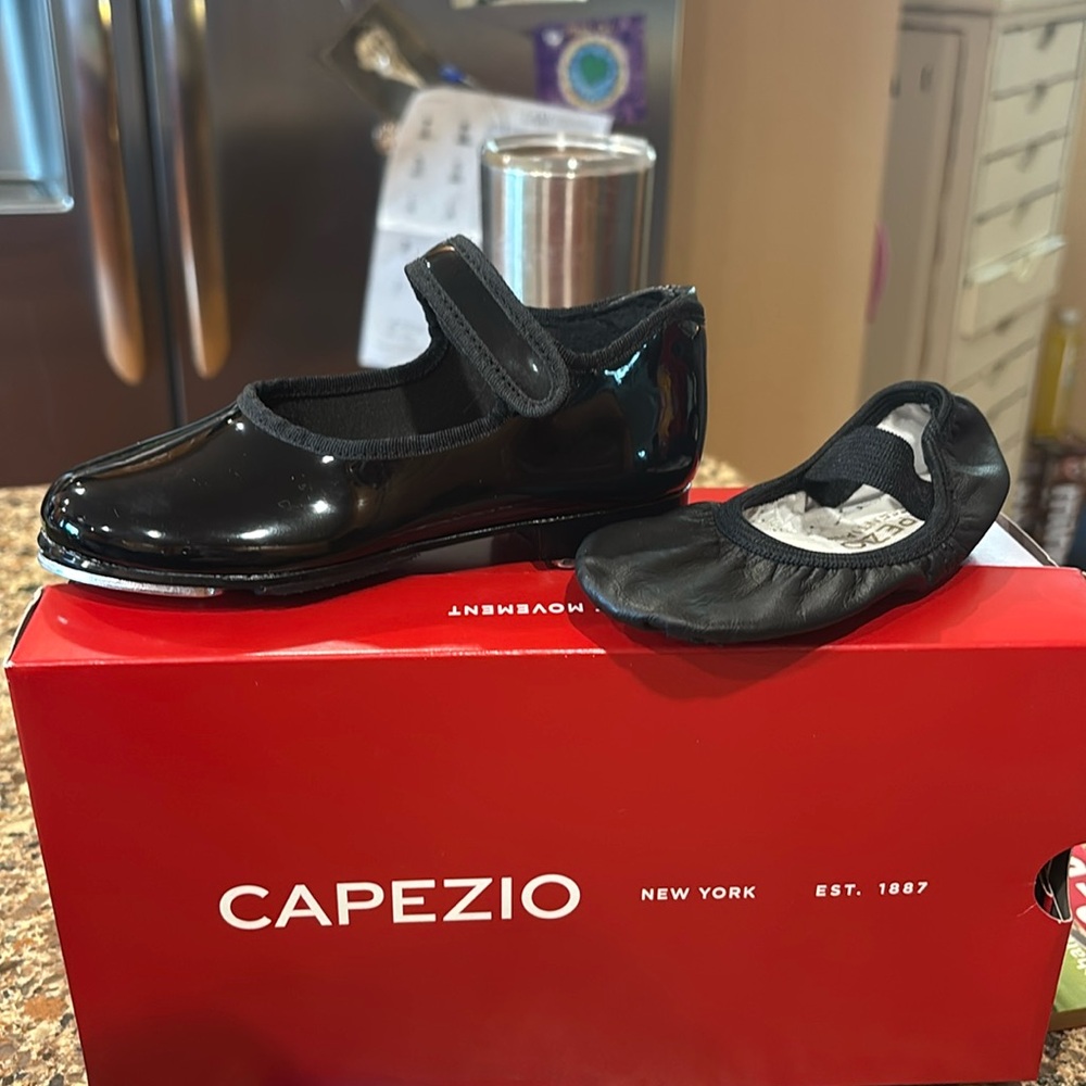 Tap shoe has never been worn.  Ballet shoe has been worn twice.